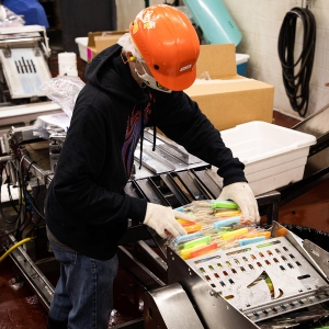 Photo of Employee in Factory Organizing Twinpops